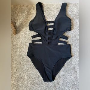 Brand Tini Bikini black one piece with side cut outs and deep V swimsuit Size S